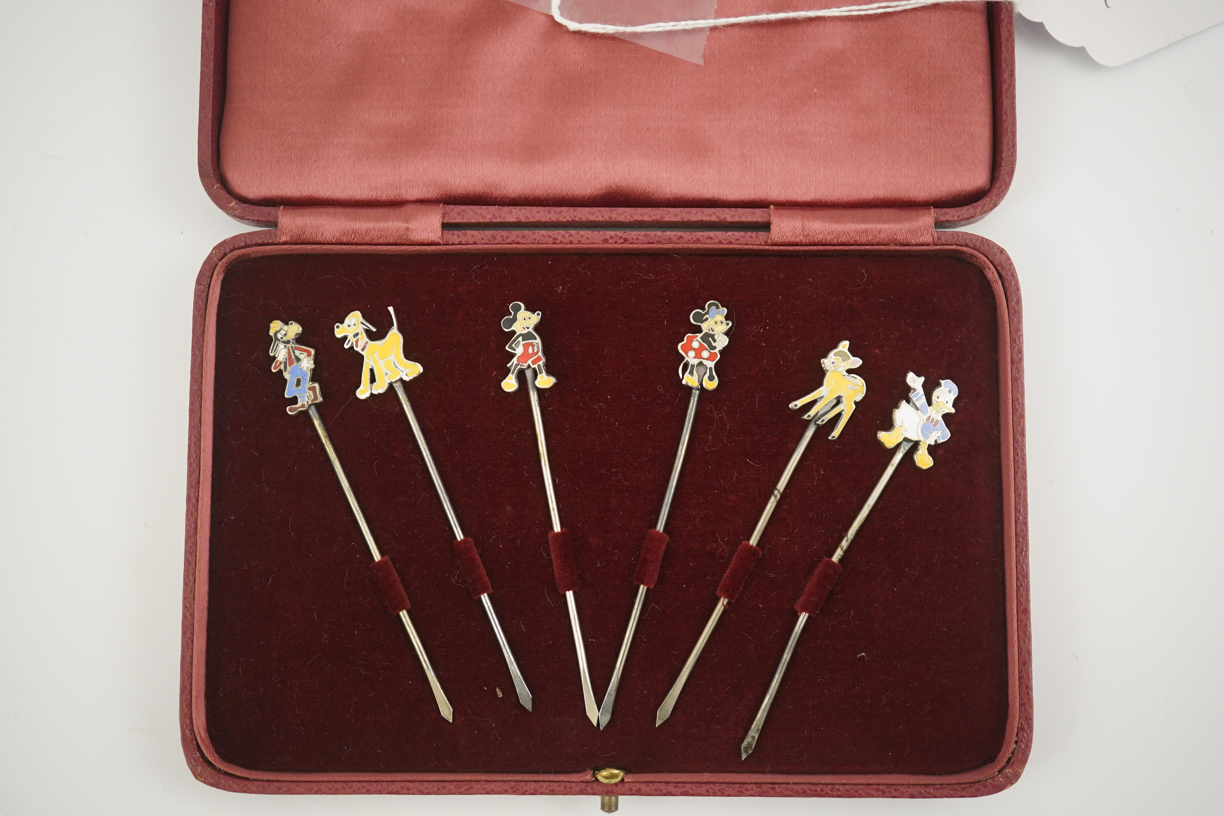 A cased set of six enamelled sterling Disney Character cocktail sticks